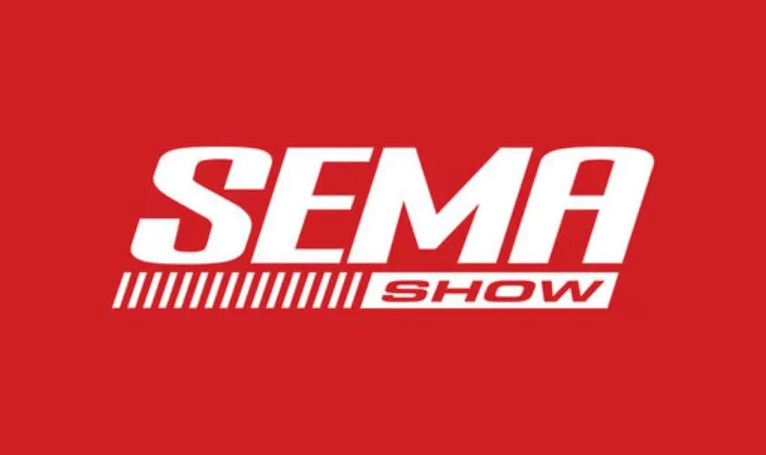 SEMA show floor with custom C8 Corvette and Ferrada wheels on display